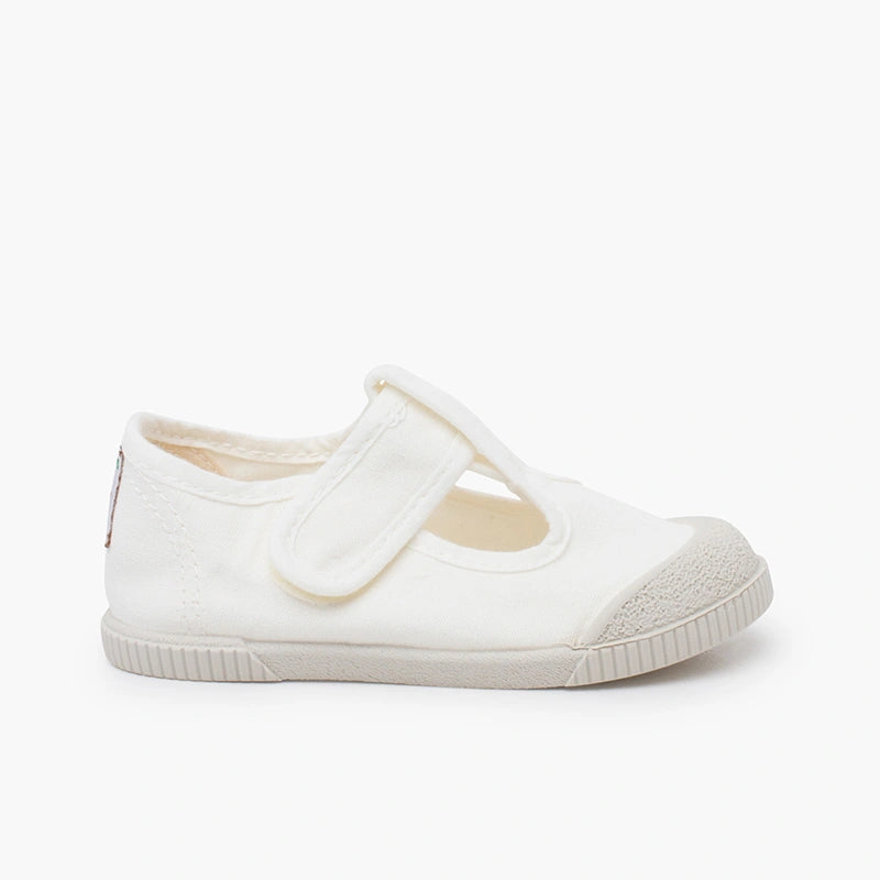 White shoe with a velcro strap on a white background
