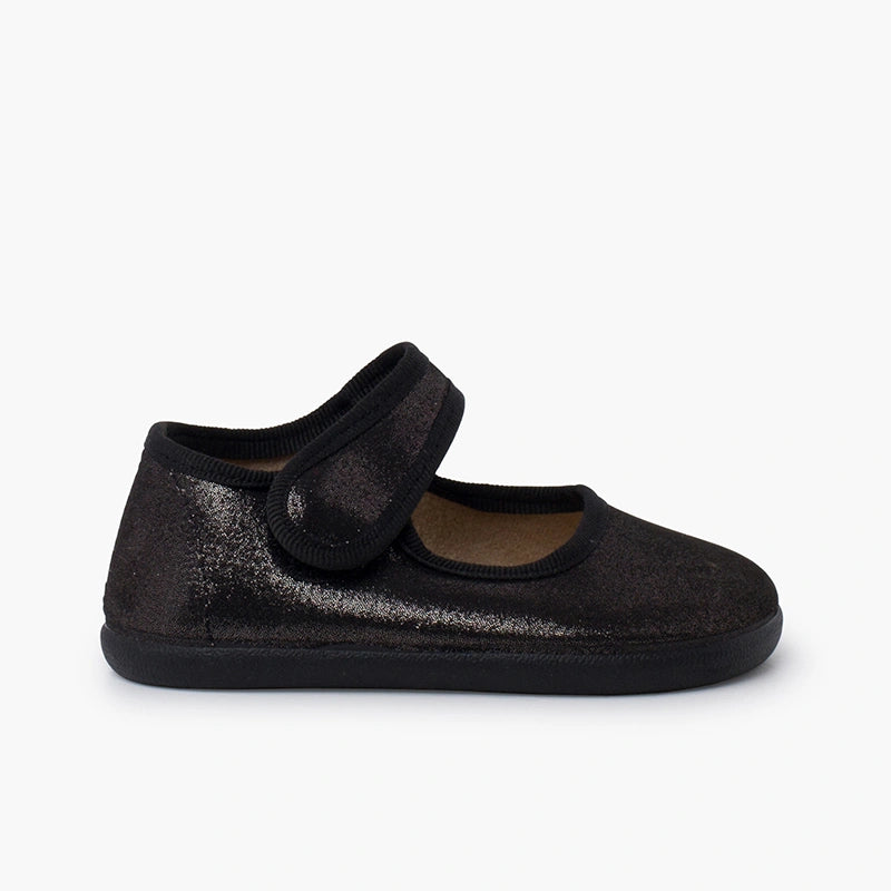 Black shoe with a strap on a white background