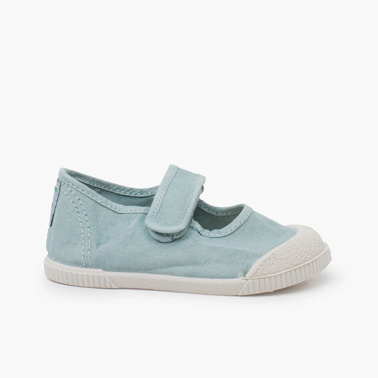Acquamarine children's shoe with a velcro strap on a white background