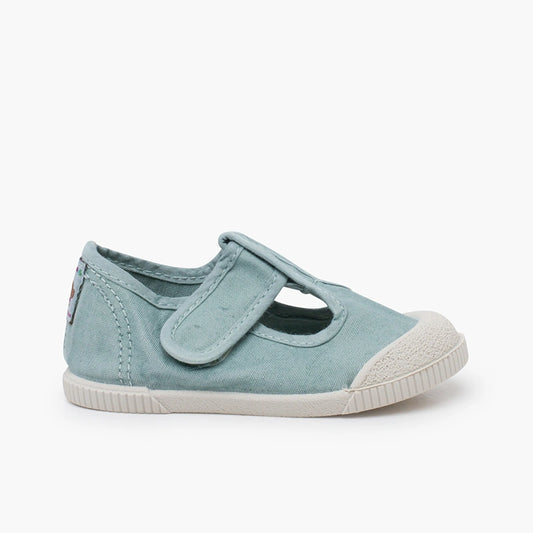 Acquamarine children's shoe with a white sole on a white background