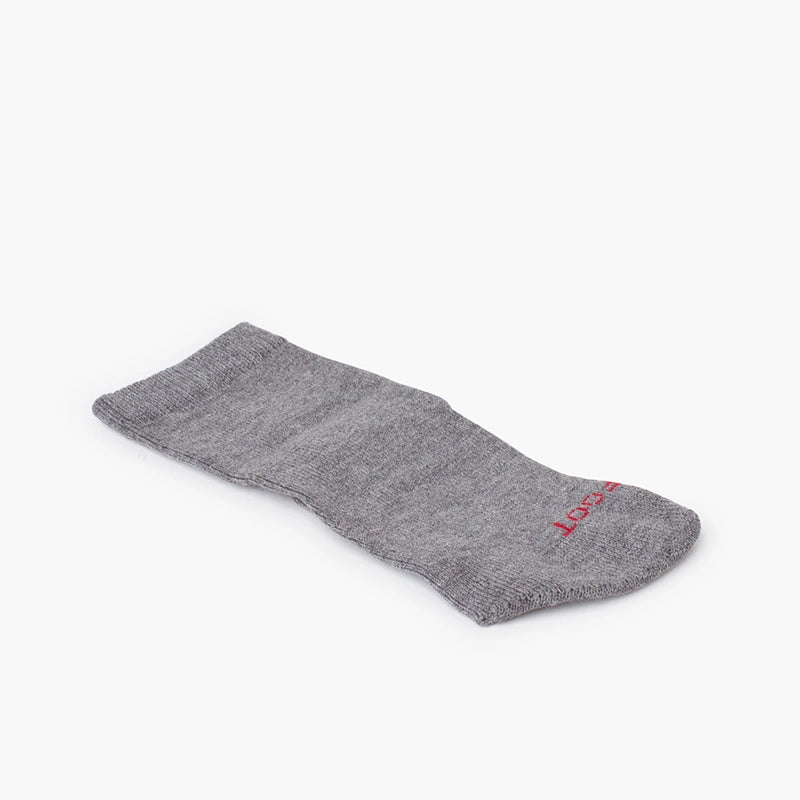Gray sock with a brand logo on a white background