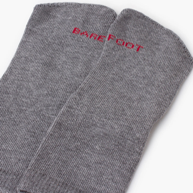 Gray socks with 'Barefoot' text on a white background