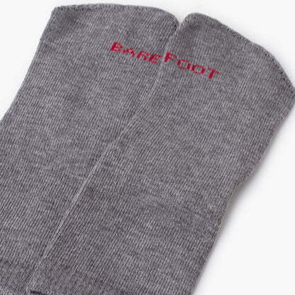 Gray socks with 'Barefoot' text on a white background