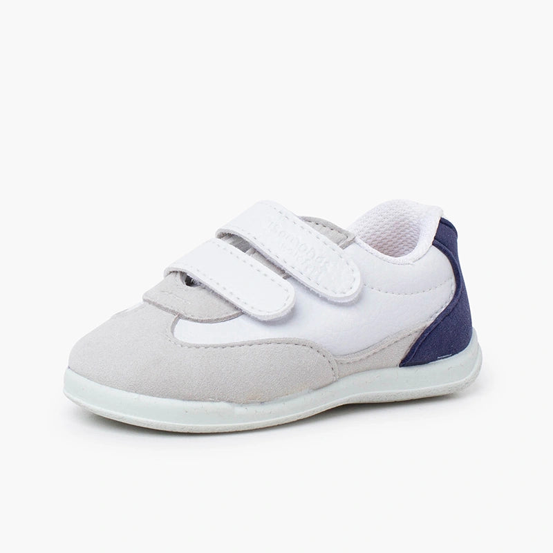 White and gray children's shoe with a strap on a white background