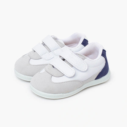 Pair of children's shoes with white and gray design on a white background