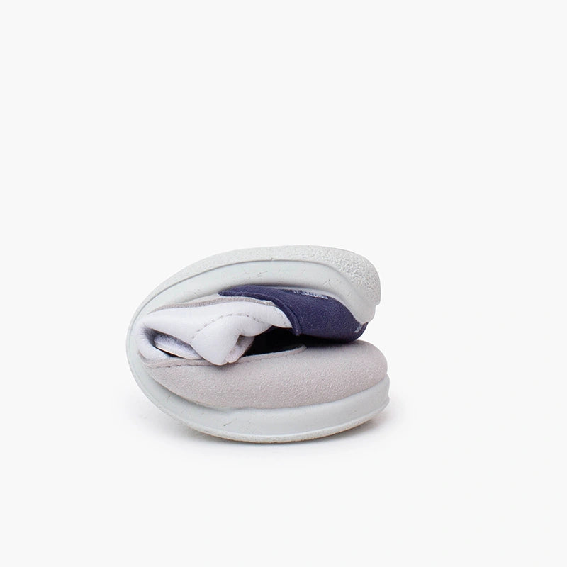 Gray and white slippers on a white background