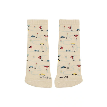 Beige socks with car and road pattern on a white background
