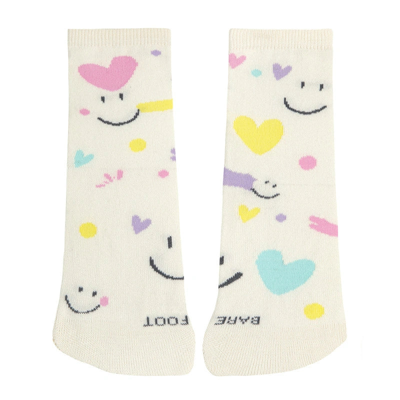 Pair of socks with smiley faces and colorful hearts on a white background