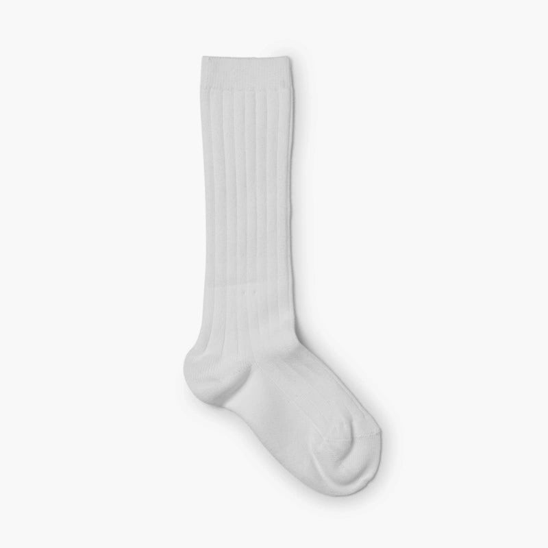 White knee-high sock on a light gray background