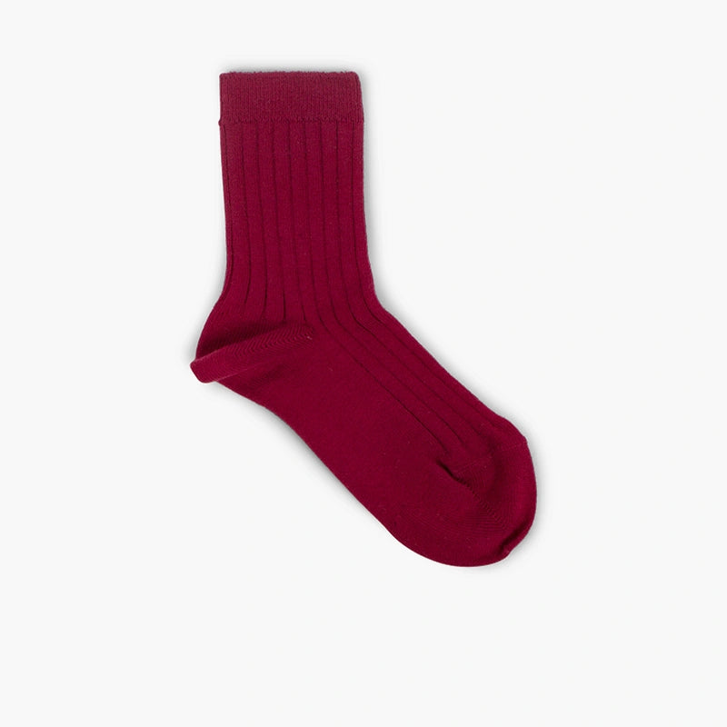 Burgundy sock on a light gray background