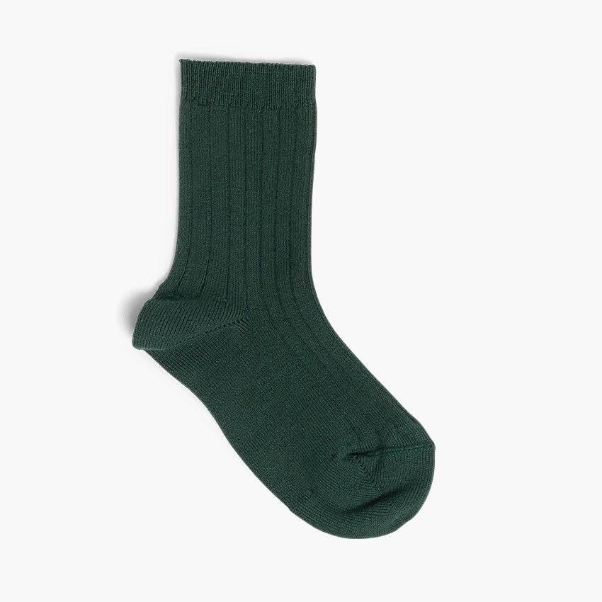 Green sock on a light gray background