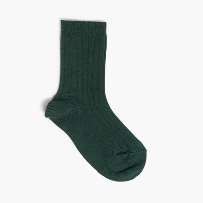 Green sock on a light gray background
