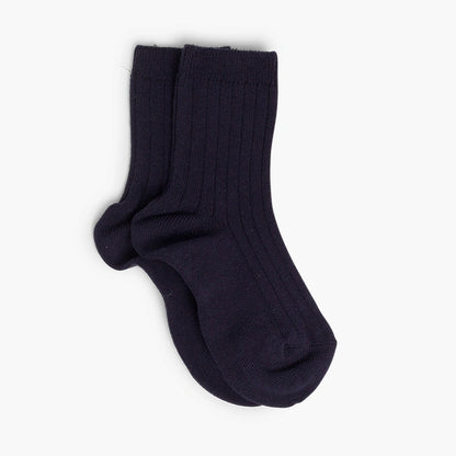 Pair of navy blue socks on a white background