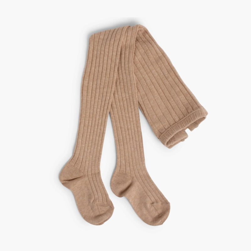Pair of beige ribbed tights on a white background