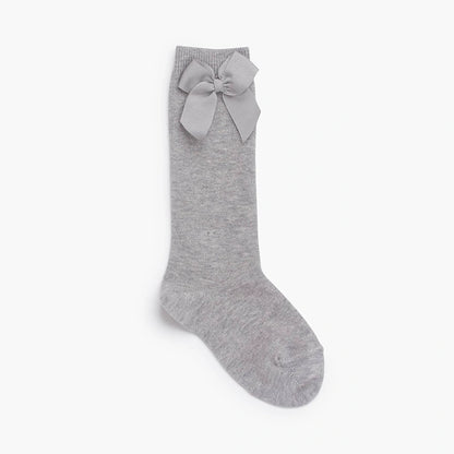 Gray knee-high sock with a bow on a white background