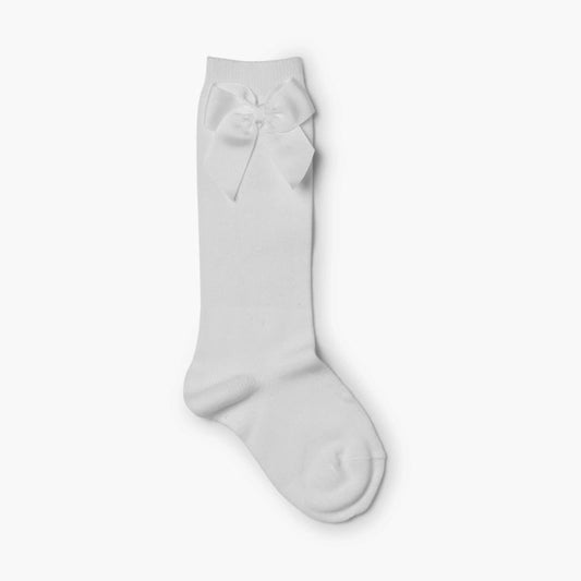 White knee-high sock with a bow on a white background