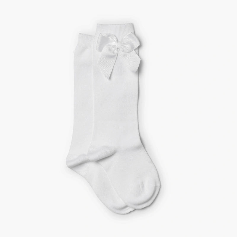 White knee-high sock with a bow on a white background