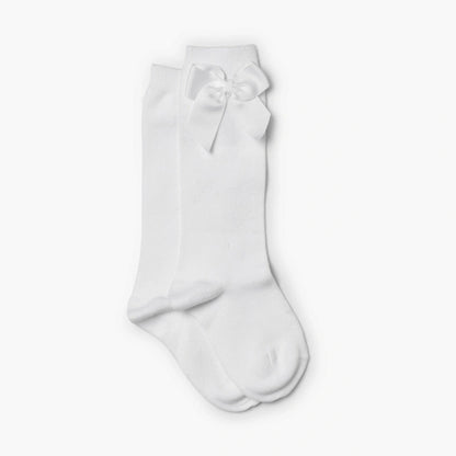 White knee-high sock with a bow on a white background