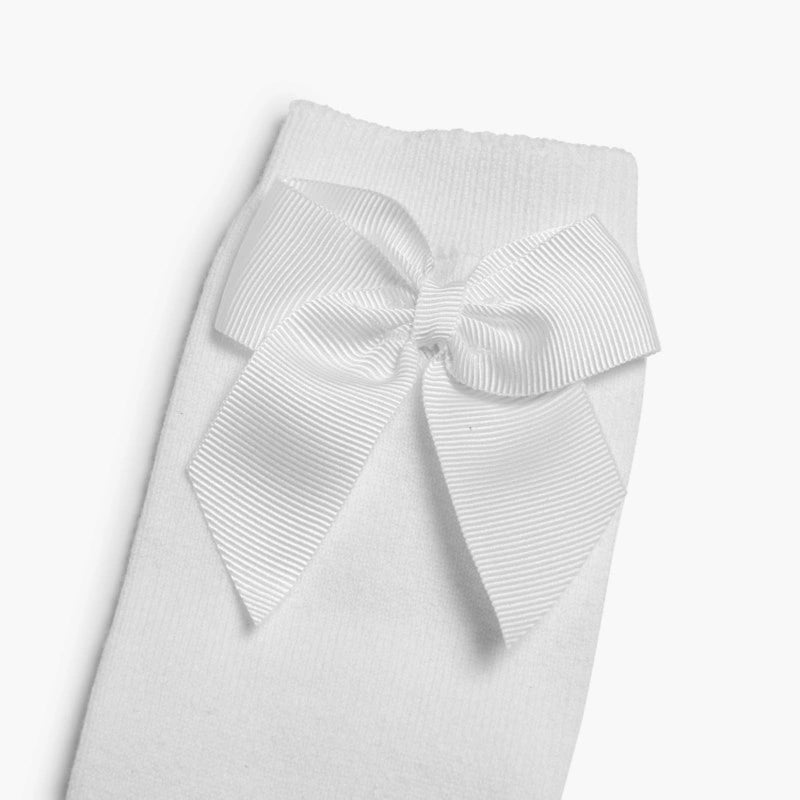 White ribbed tights with a large bow on a light gray background