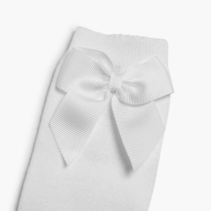 White ribbed tights with a large bow on a light gray background