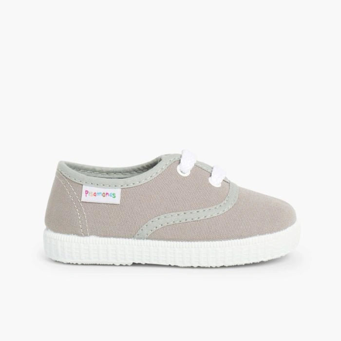 Gray sneaker with white sole on a white background