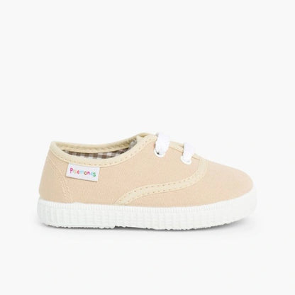 Beige sneaker with white sole on a white background