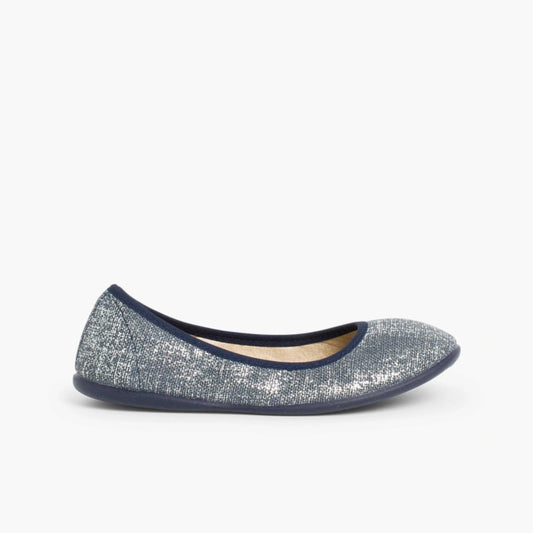 Navy blue glittery flat shoe on a white background