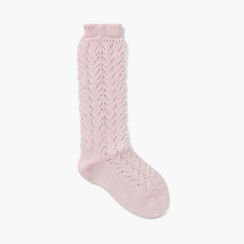 Pink knitted knee-high sock on a white background