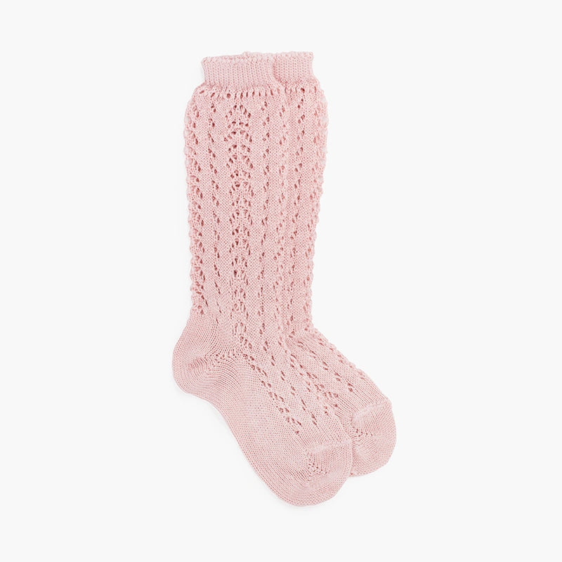 Pink knitted sock on a white background