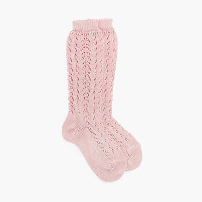 Pink knitted sock on a white background