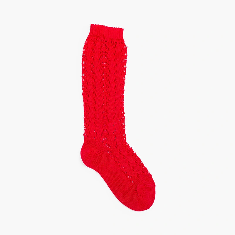 Red knitted knee-high sock on a white background