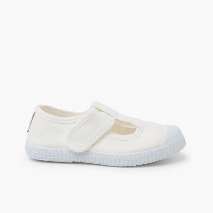 White shoe with a strap on a white background
