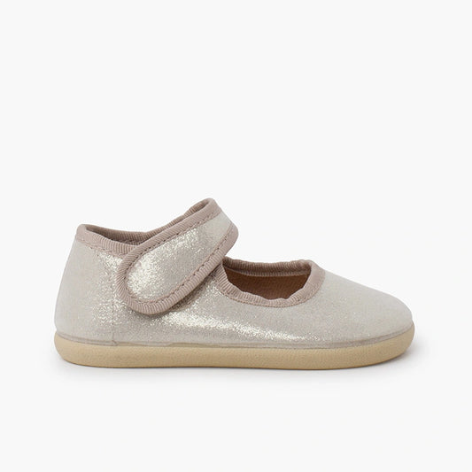 Pair of glittery baby shoes on a white background