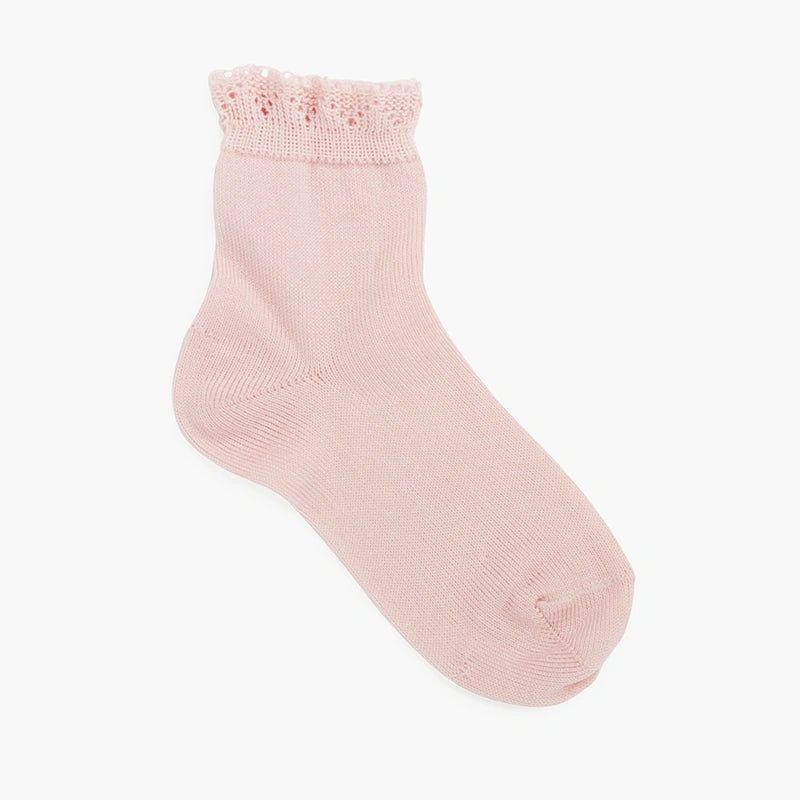 Pink sock with lace top on a white background