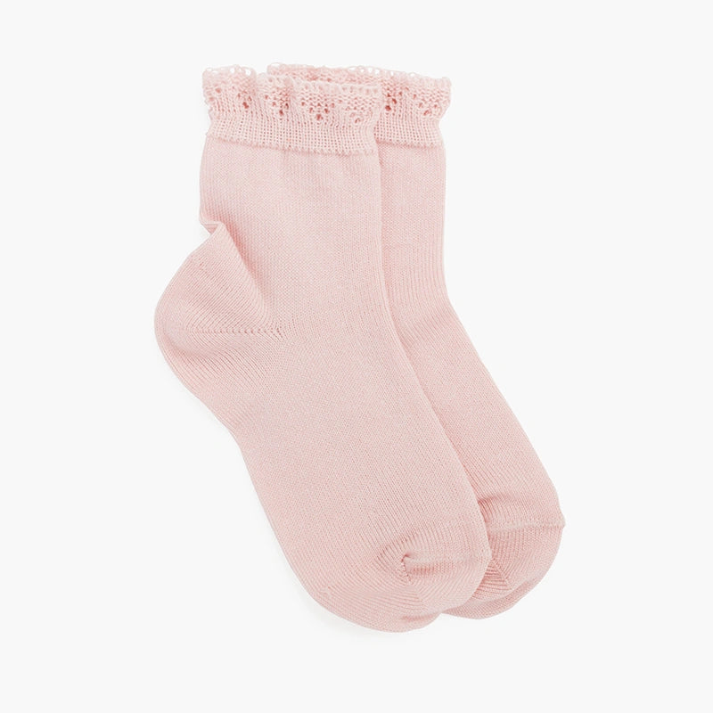 Pair of light pink socks with lace trim on a white background